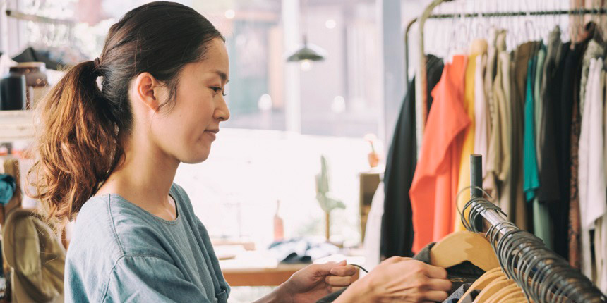 A lady shopping in a second-hand clothes store